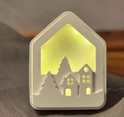 Lichthaus mit weihnachtshäuschen