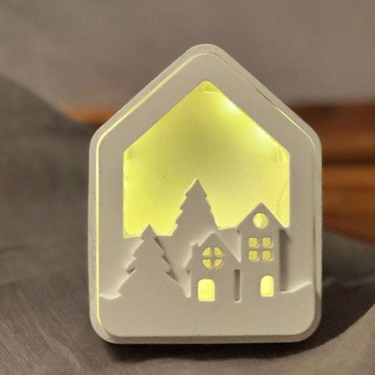 Lichthaus mit weihnachtshäuschen